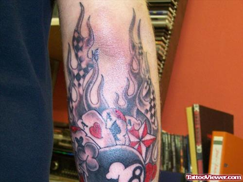 Flaming Cards Gambling Tattoo On Arm