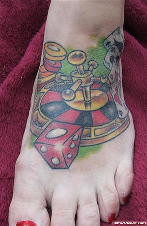Awesome Colored Gambling Tattoo On Left Foot