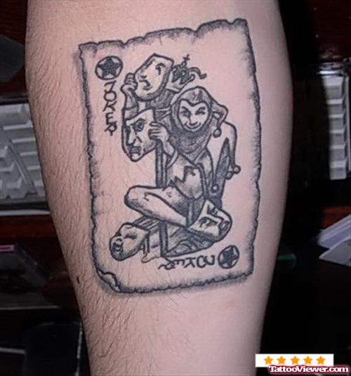 Grey Ink Gambling Joker Tattoo On Arm