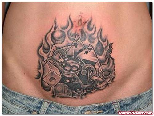 Grey Ink Flaming Gambling Tattoo On Belly
