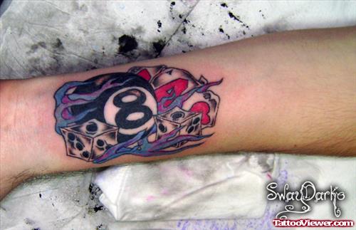 Eightball and Dice Gambling Tattoo On Arm