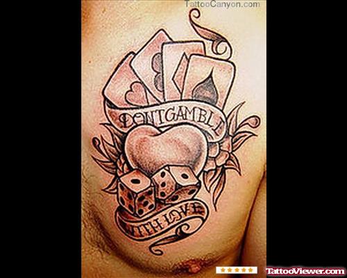 Cards and Heart With Dice and Banner Gambling Tattoo On Man Chest