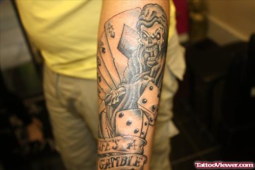 Attractive Grey Ink Cards And Dice Gambling Tattoo on Right Arm
