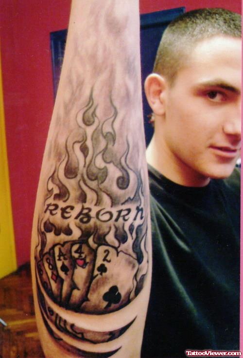 Grey Ink Flaming Gambling Tattoo On Right Arm