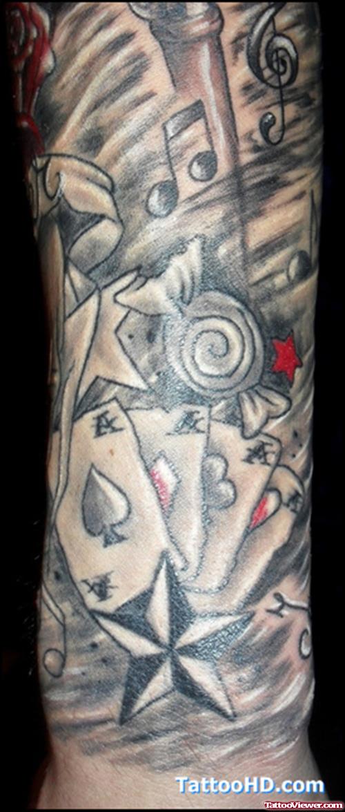 Grey Ink Cards And Nautical Star Gambling Tattoo