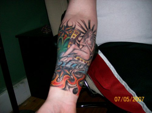 Flaming Gambling Tattoo On Right Forearm