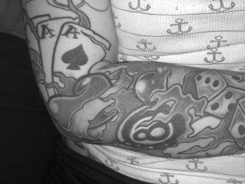 Grey ink Dice Eaightball And Cards Gambling Tattoo On Right Arm