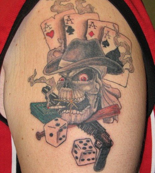 Grey Ink Skull With Hat And Gambling Cards Tattoos On Shoulder