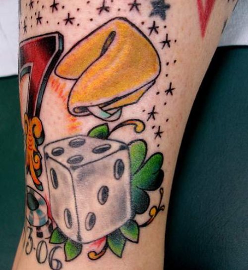 Grey Ink Dice And Gambling Tattoo On Bicep