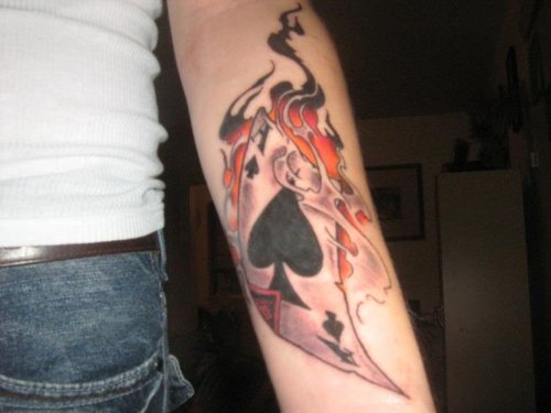 Flaming Card Gambling Tattoo On Left Arm