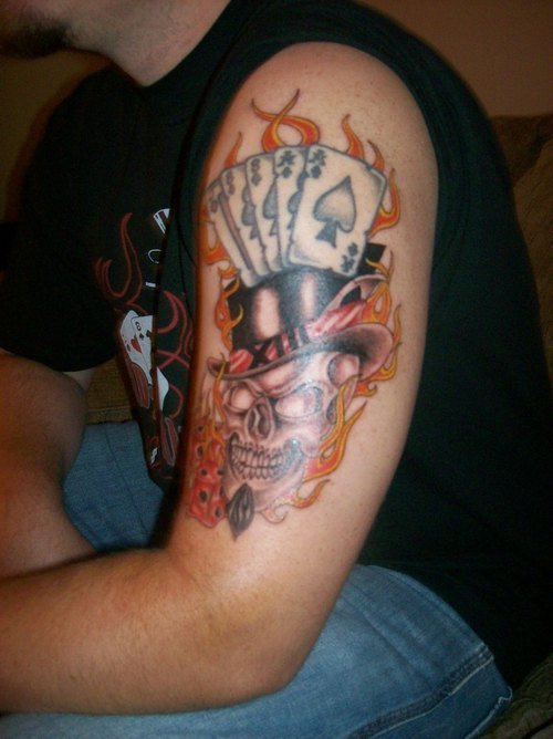 Flaming Cards And Skull With Hat Gambling Tattoo On Left Sleeve