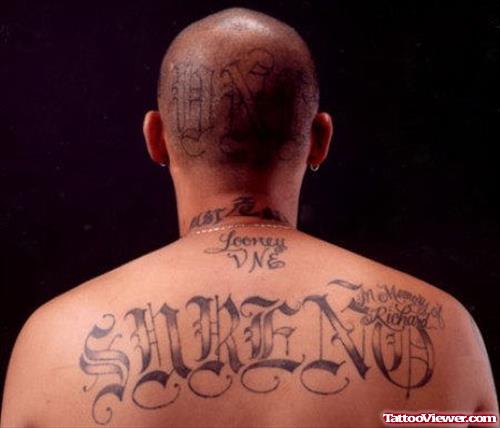 Grey Ink Ambigram Gangsta Tattoo On Upperback