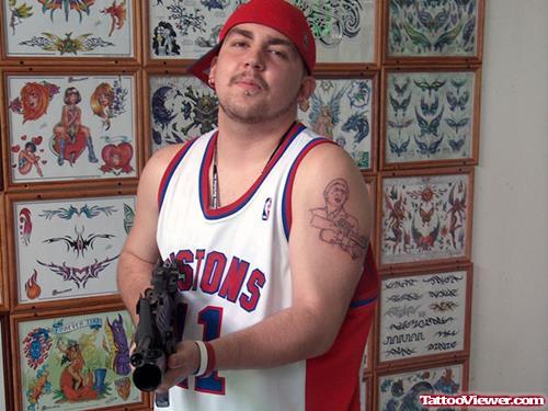 Man With Gangsta Tattoo On Left Half Sleeve