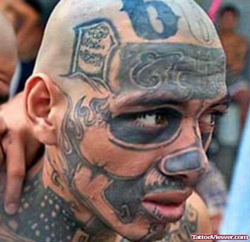 Grey Ink Gangsta Tattoo On Man Face