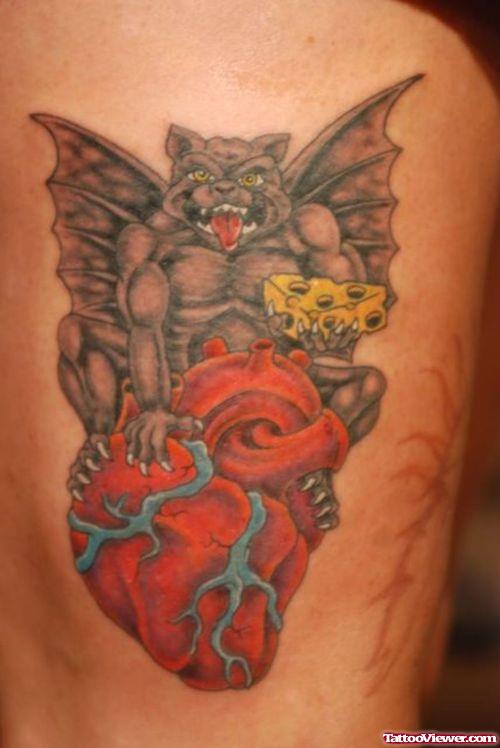 Real Human Heart And Gargoyle Tattoo On Leg