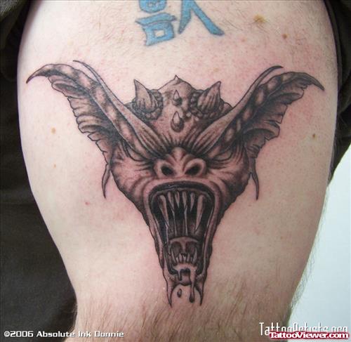 Grey Ink Gargoyle Head Tattoo On Left Shoulder