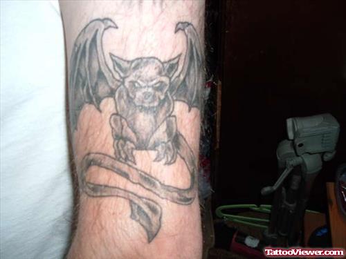 Grey Ink Gargoyle Tattoo On Bicep