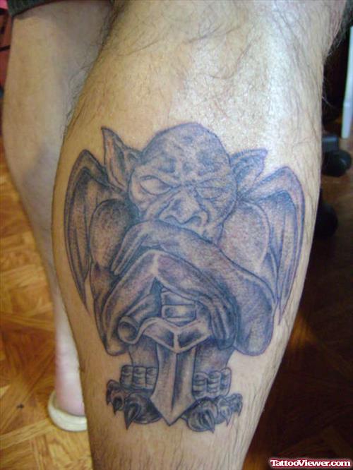 Grey Ink Gargoyle Tattoo On Back Leg