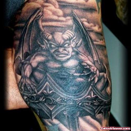 Dark Ink Cross And Gargoyle Tattoo