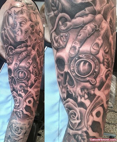 Grey Ink Skull And Gargoyle Tattoos On Sleeve