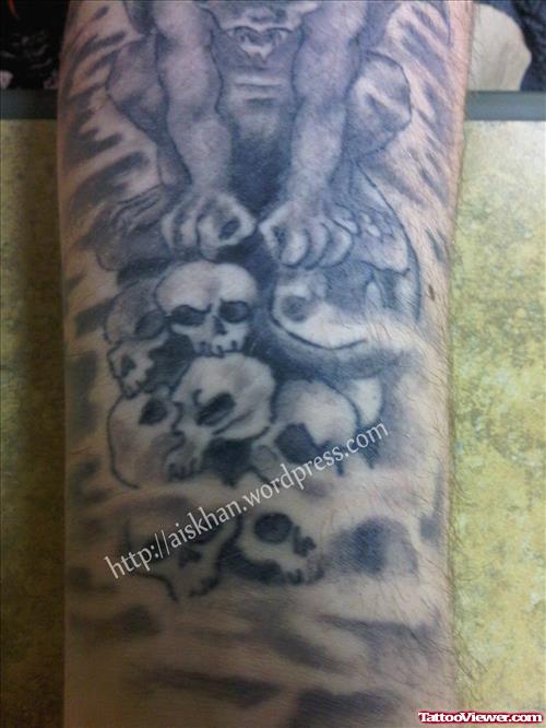 Grey Skulls And Gargoyle Tattoo