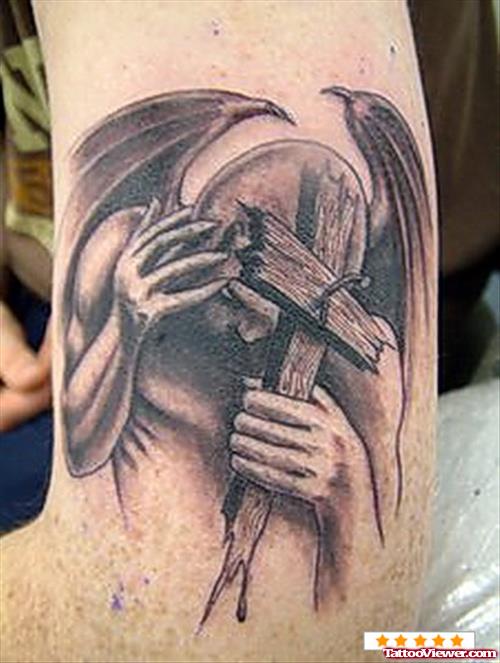 Attractive Cross And Gargoyle Tattoo