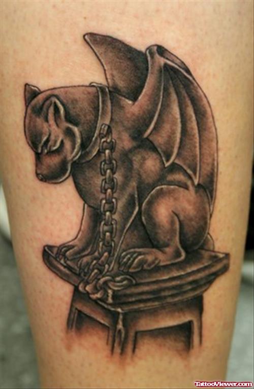 Grey Ink Gargoyle Tattoo On Left Bicep