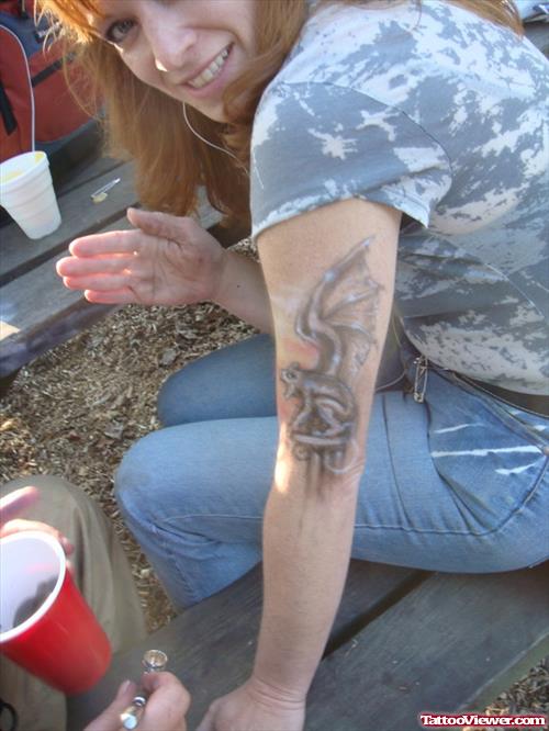 Girl With Gargoyle Tattoo On Left Half Sleeve