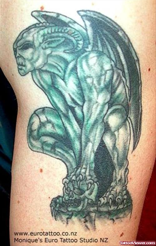Attractive Green Ink Gargoyle Tattoo On Half Sleeve