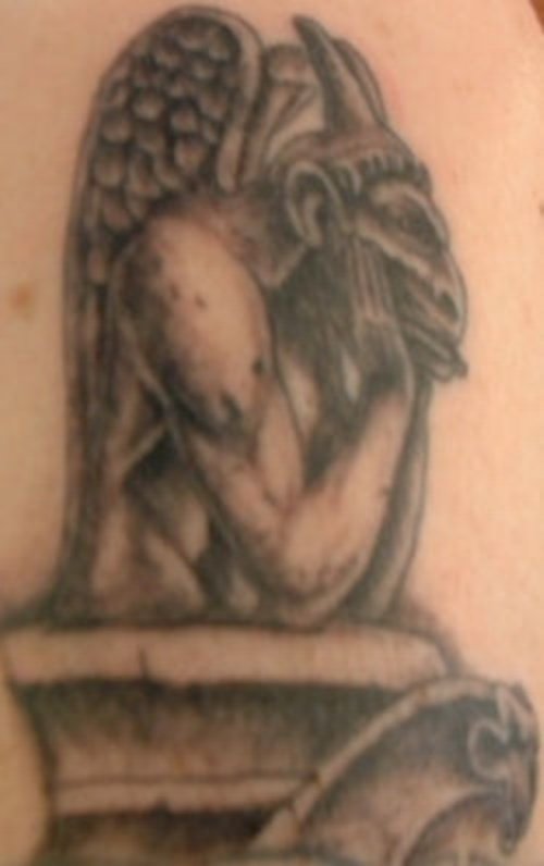 Grey Ink Sad Gargoyle Tattoo