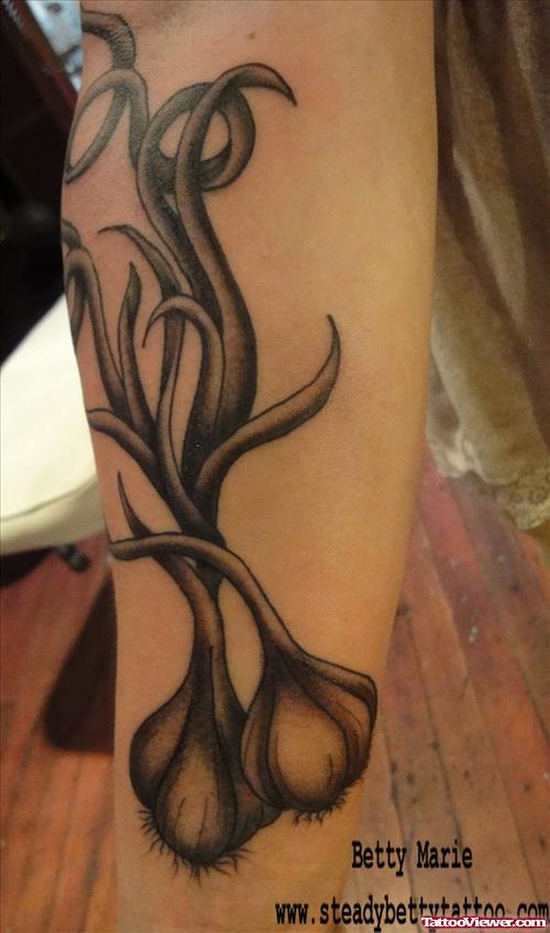 Awesome Grey Ink Garlic Tattoo On Leg