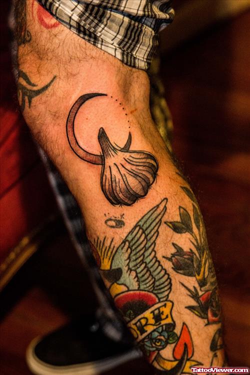 Grey Ink Garlic Tattoos On Left Leg