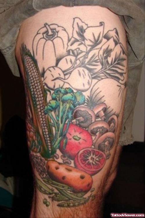 Awesome Colored Garlic Tattoo On Right Leg