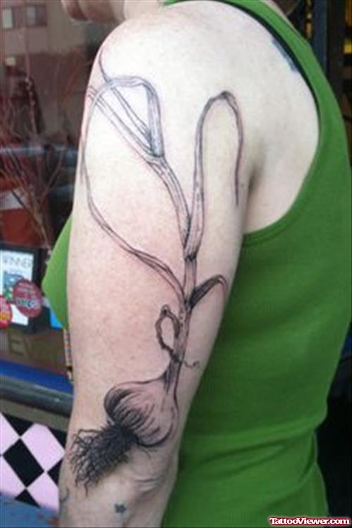 Grey Ink Garlic Tattoo On Left Sleeve