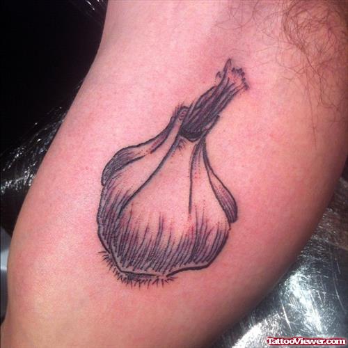 Grey Ink Garlic Tattoo On Arm