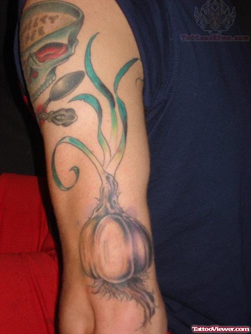 Garlic Tattoo On Muscle