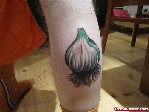 Large Garlic Tattoo On Men Calf