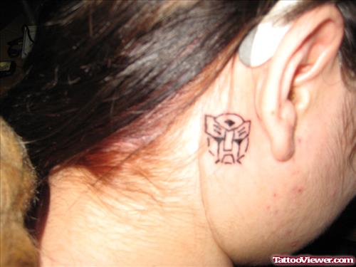 Geek Tattoo On Girl Back Ear