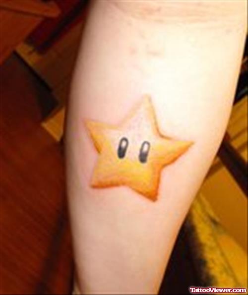 Yellow Ink Star Geek Tattoo on Arm