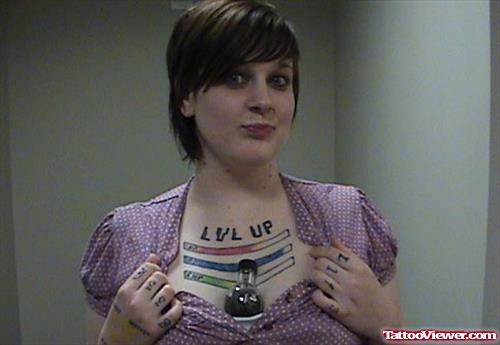 Level Up Geek Tattoo On Girl Chest