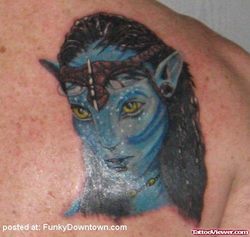 Blue Ink Avtar Head Geek Tattoo On Back Shoulder