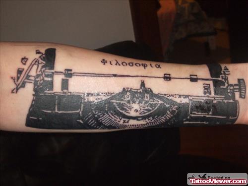 Cute Grey Ink Geek Tattoo On Arm