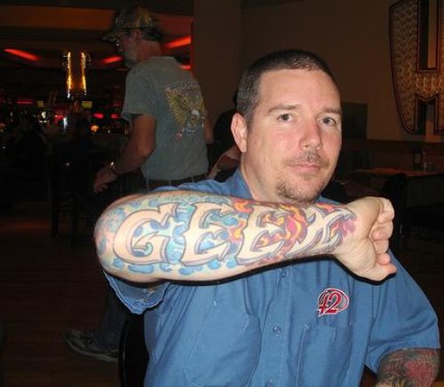 Awesome Colored Geek Tattoo On Man Right Arm
