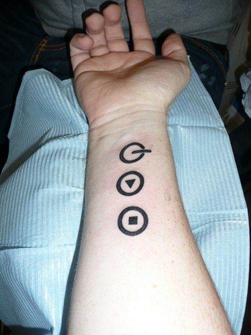 Geek Buttons Tattoo On Right Forearm