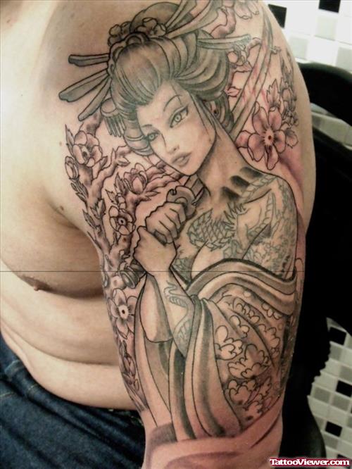 Grey Ink Geisha Tattoo On Left Biceps
