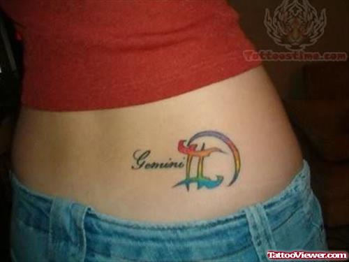 Color Ink Gemini Tattoo On Girl Lowerback