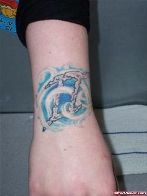Blue Ink Gemini Tattoo On Right Arm