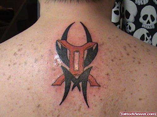 Black Ink Tribal And Red Gemini Tattoo On Upperback