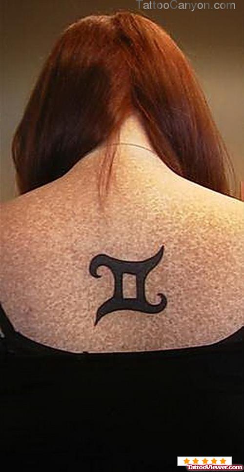 Black ink Gemini Tattoo On Girl Upperback