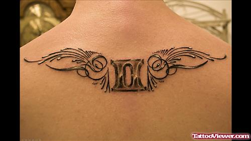 Grey Ink Winged Gemini Tattoo On Upperback